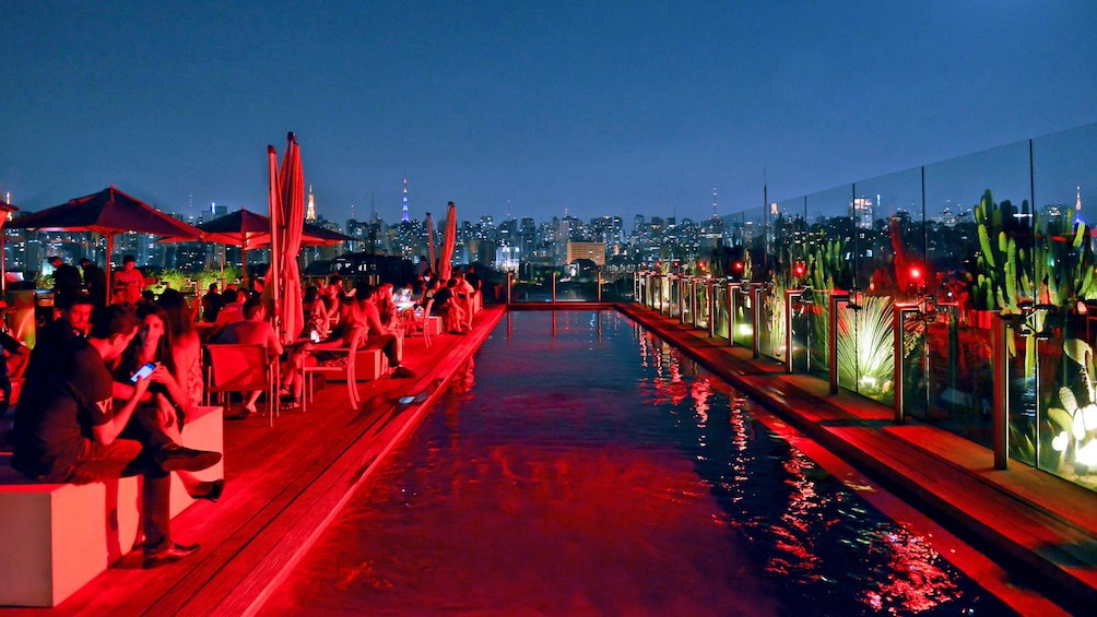 Show item 4 of 4. socializing on a rooftop in Brazil
