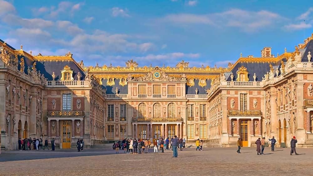 outside at the entrance to Versailles in Paris