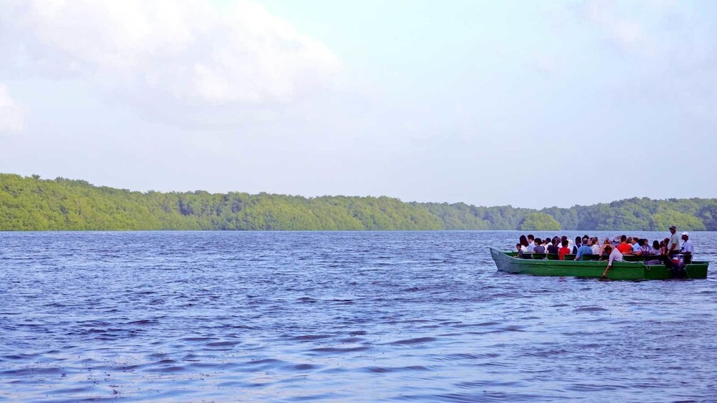 boat full of passengers out in the water in Trinidad and Tobago