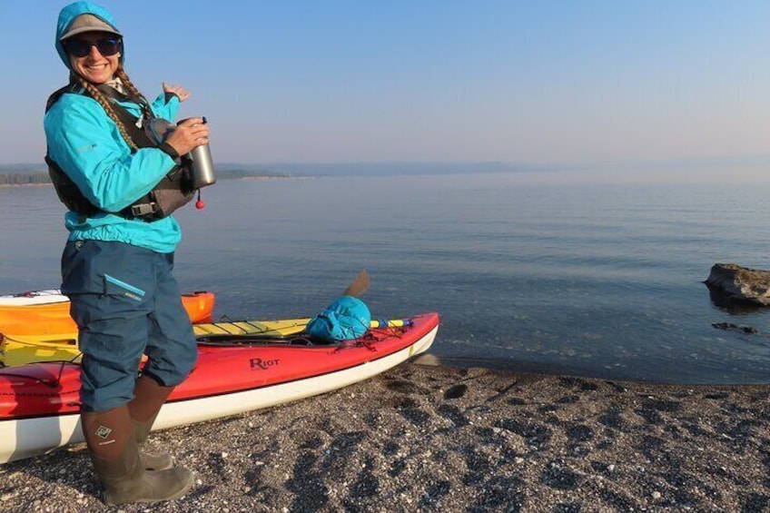 The morning light shines on the sea kayak guide.