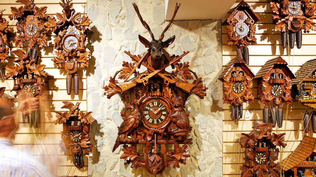 hand carved wooden clocks on display in Switzerland