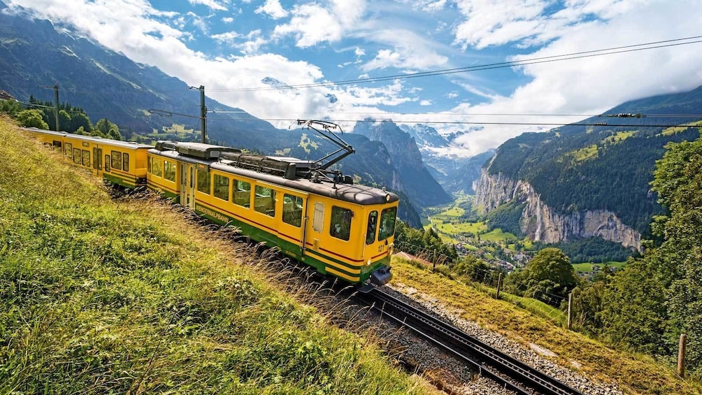 train running along the mountain scape in Switzerland