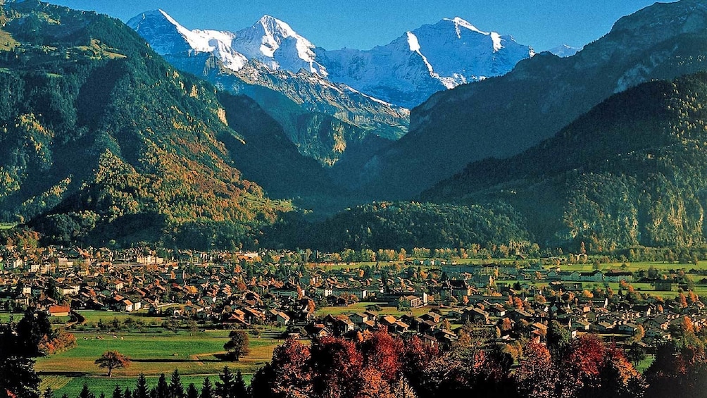 village at the foot of steep mountains in Switzerland