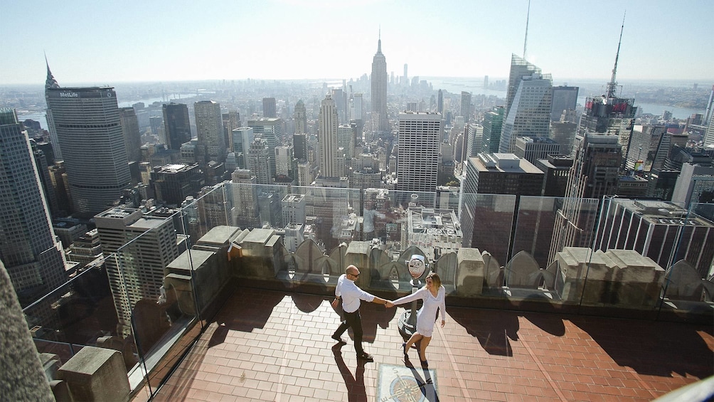 Stunning day view of a photo shoot of a couple at the Top of the Rock in New York 