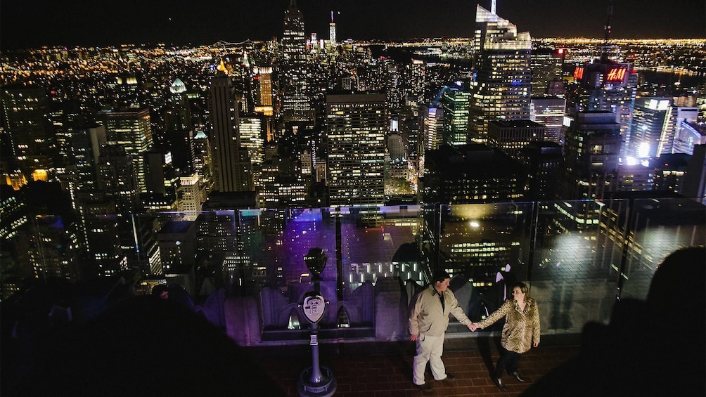 Couple on a photo shoot at the top of the rock in New York at night 