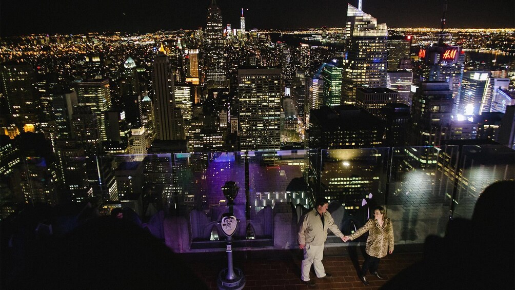 Couple on a photo shoot at the top of the rock in New York at night 