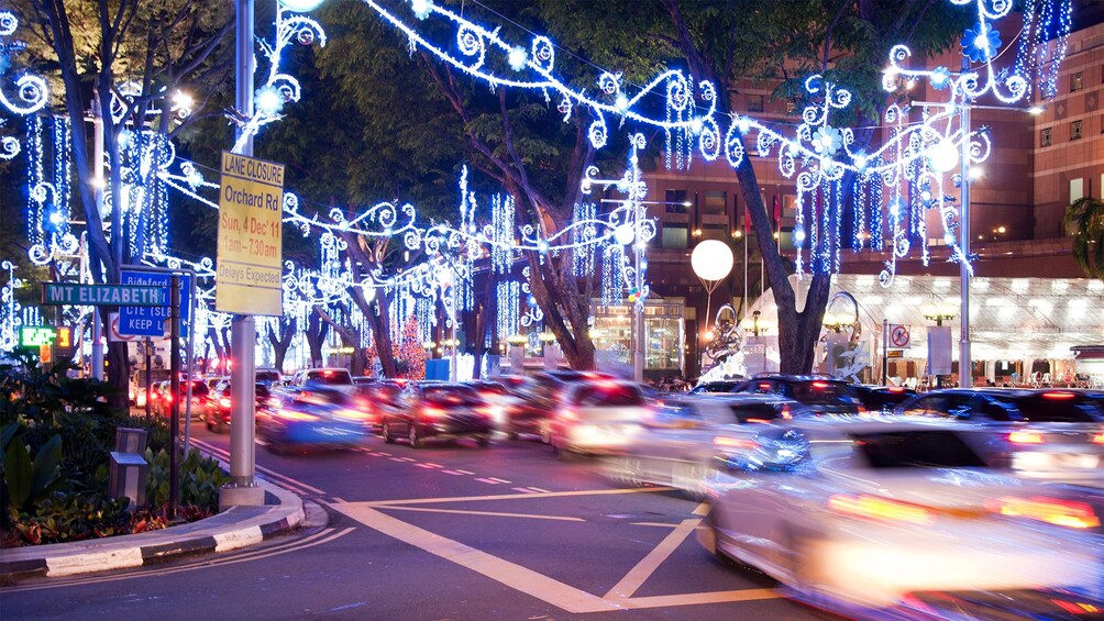 Busy street view of Singapore at night 