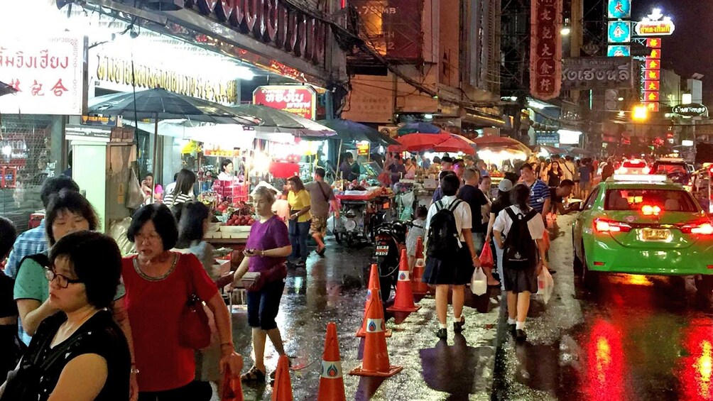 walking through the crowds at the night market in Bangkok