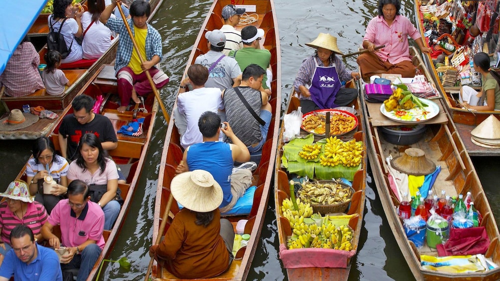 Show item 1 of 6. Vibrant view of the Damnoen Saduak Floating Market in Bangkok, Thailand