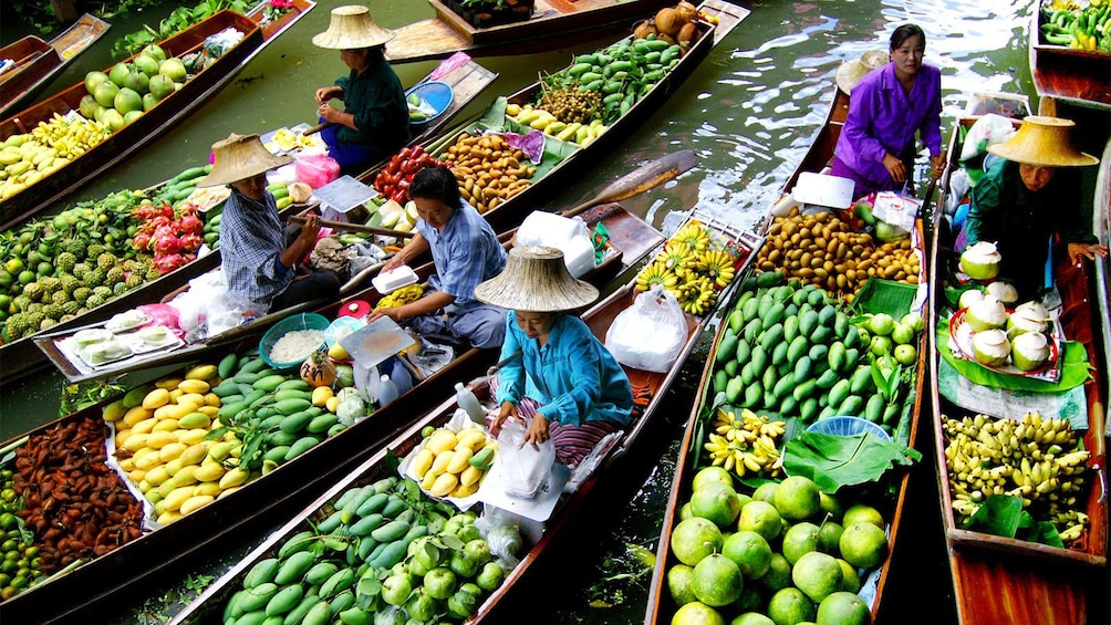 Show item 5 of 6. Beautiful view of the vendors at the Damnoen Saduak Floating Market in Bangkok, Thailand