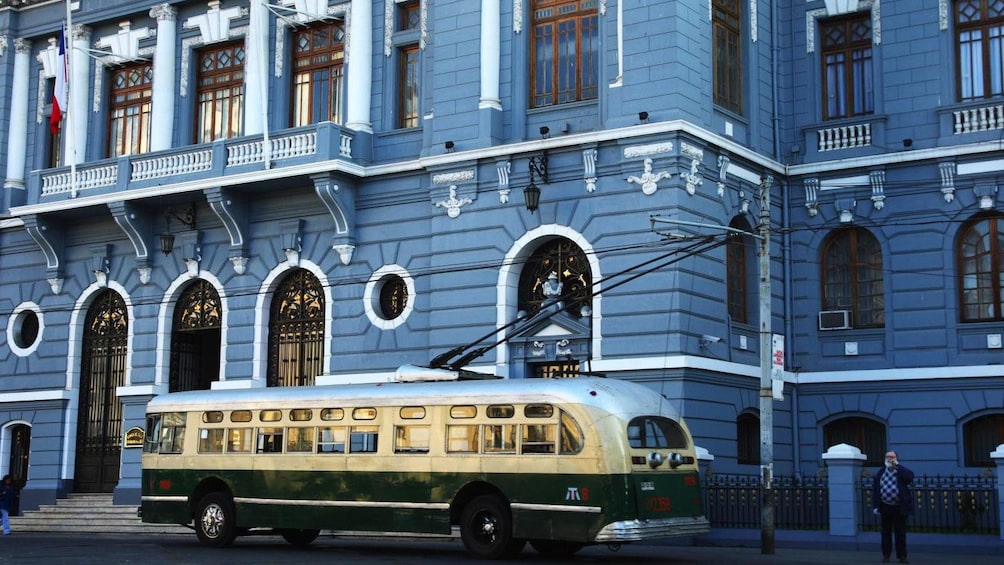 Trolley in front of historic building in Valparaiso