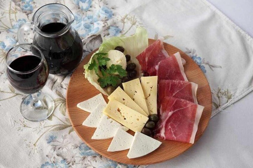 Pršut( prosciutto), local cheese, olives, home made wine