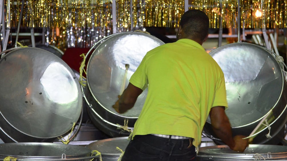 Man plays three steel drums