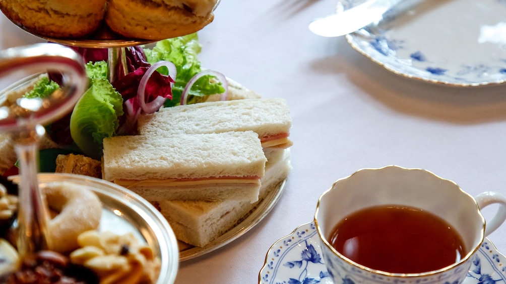 Close up of tea and sandwiches.