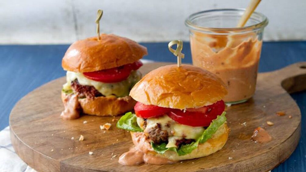 Show item 1 of 5. close up of slider burgers at cooking school