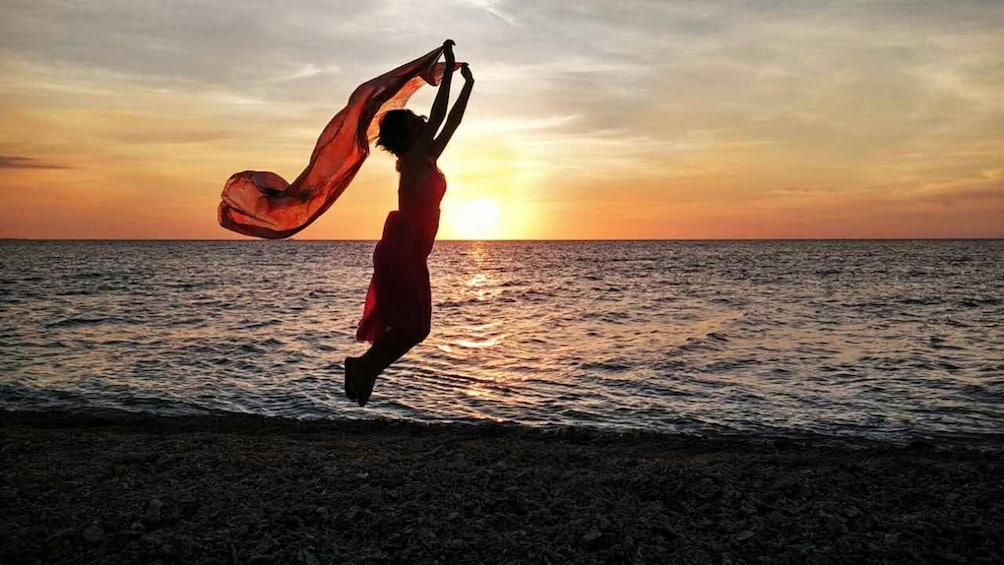 Show item 3 of 5. woman enjoying sunset on beach