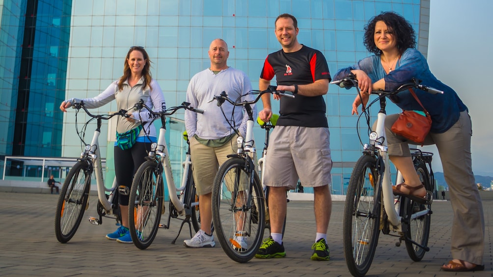 Apri foto 3 di 5. Four bicyclists pose for picture in Spain