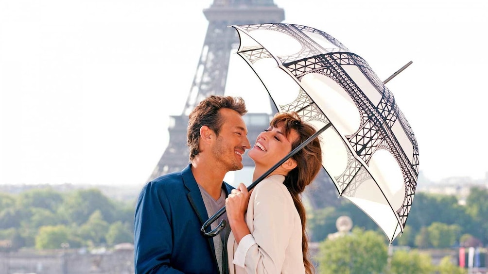couple embracing near the Eiffel Tower in Paris