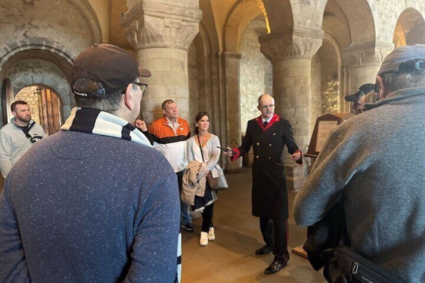 White Tower Warden and tour guests inside the White Tower
