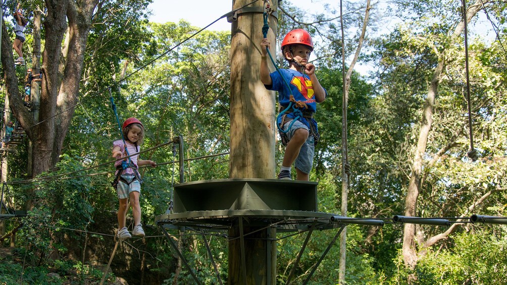 Kids having fun at a challenge course on the Kids Photo Tour in Rio de Janeiro (city), Brazil