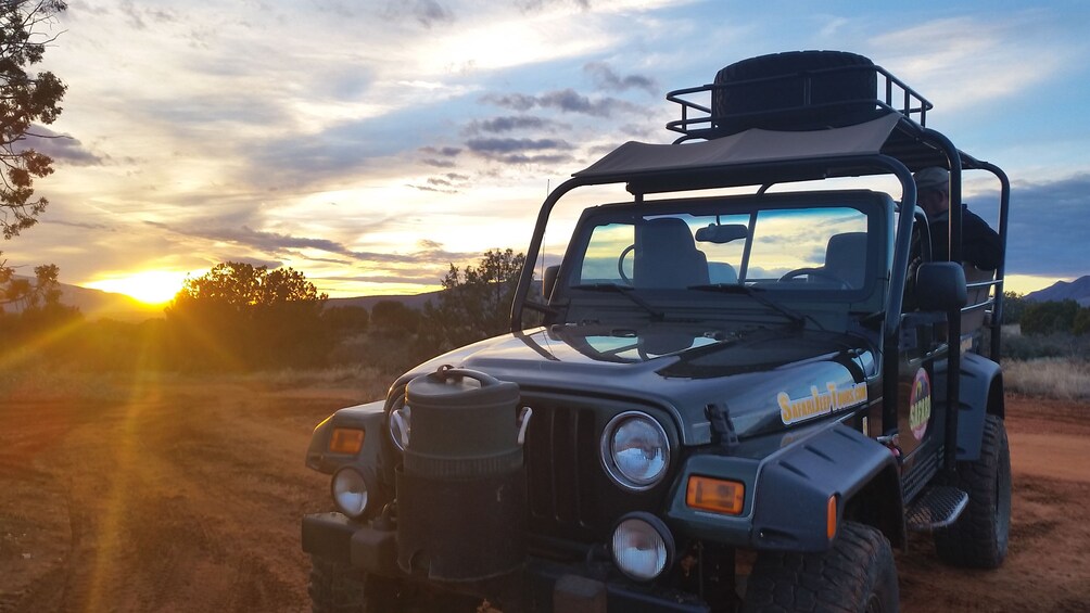 Angled view of safari jeep at sunset.