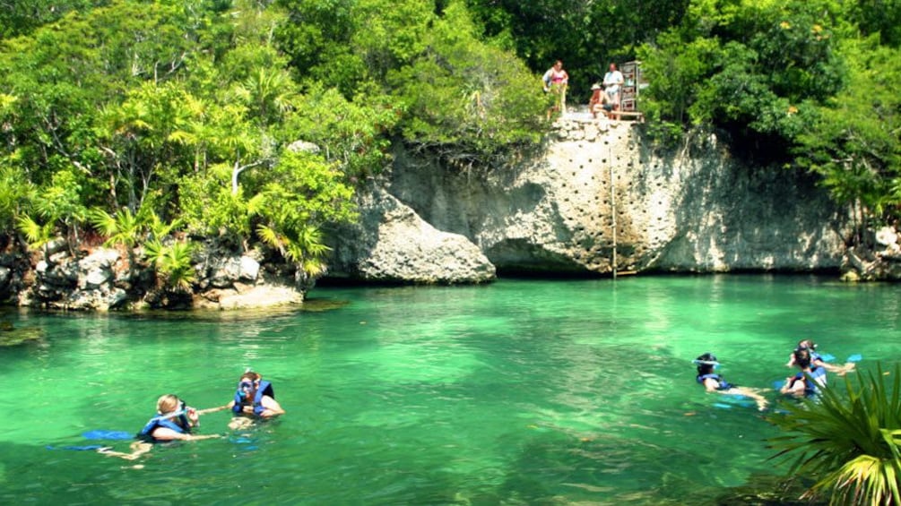 Mexican lagoon with people snorkling