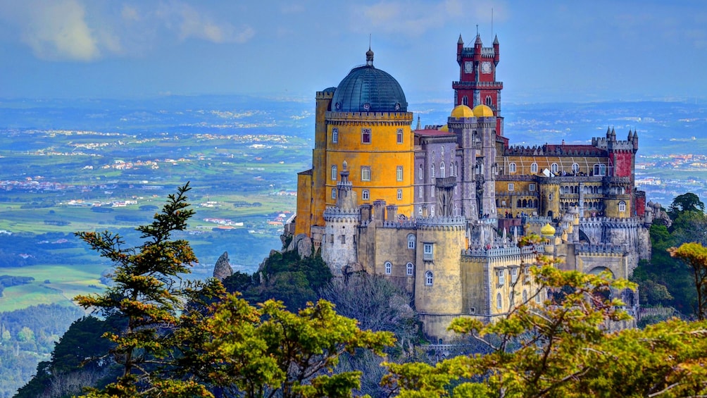 Multi-colored castle on a hill