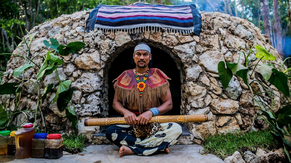 Shaman next to stone hut used for Temazcal Ritual