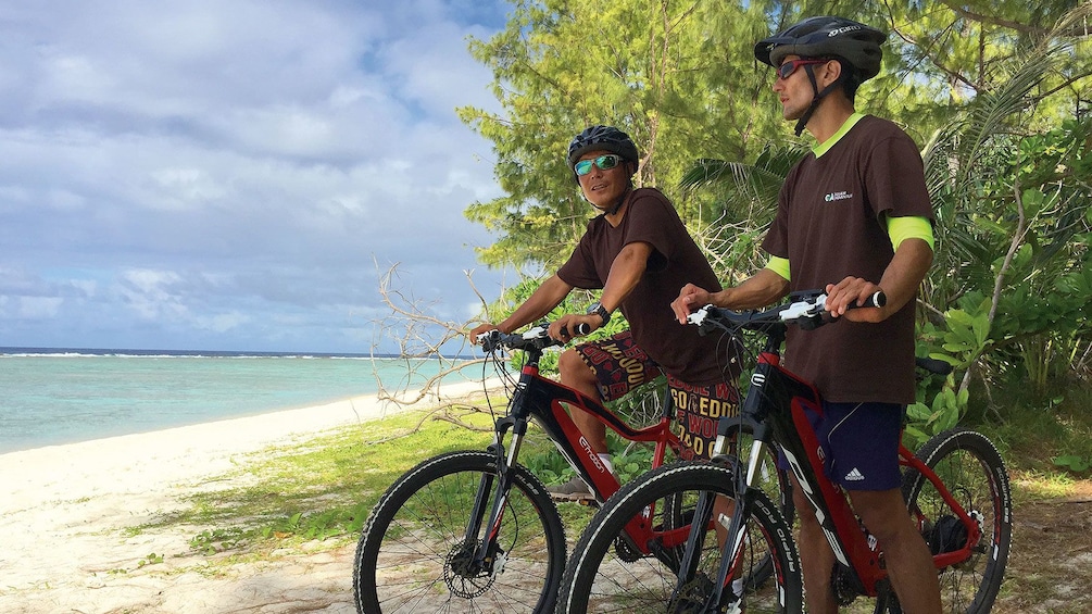 Show item 1 of 4. men on bikes near beach
