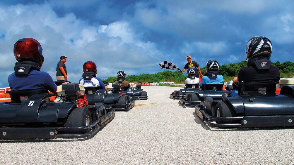 Show item 1 of 4. go karts lined up to go