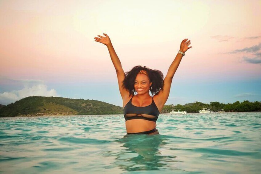 One happy girl enjoying paradise and feeling the warm waters og Caracoles Cay at La Parguera, part of the private Snorkeling, Sunset and Bioluminiscense Swim Experience by Bucketlist Tours.