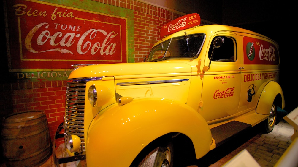 Show item 4 of 7. Vintage car and advertising display at the Wold of Coca-Cola in Atlanta