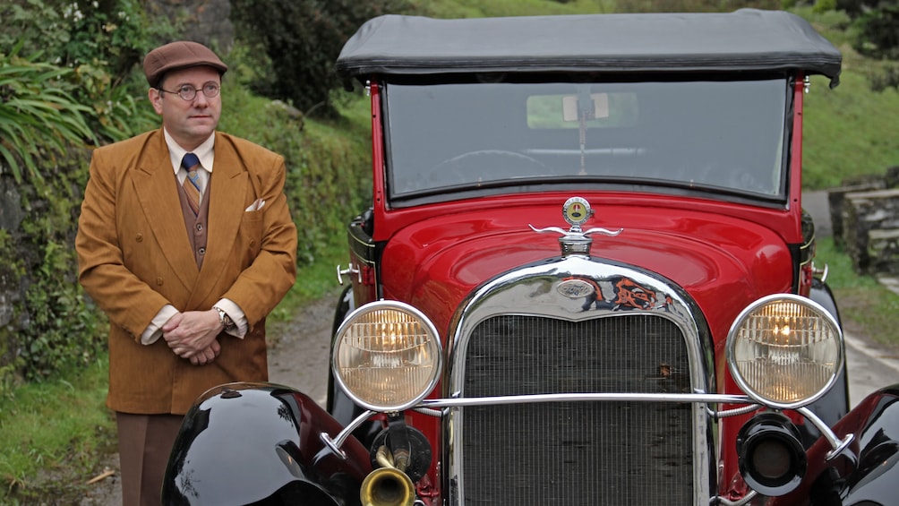 Show item 1 of 5. antique car with driver