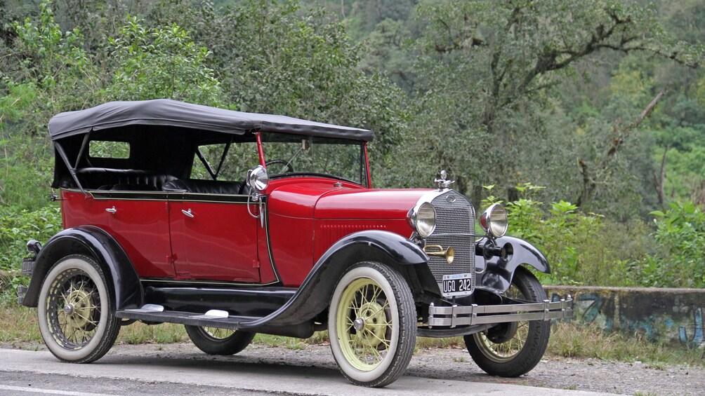 Show item 5 of 5. antique car on road