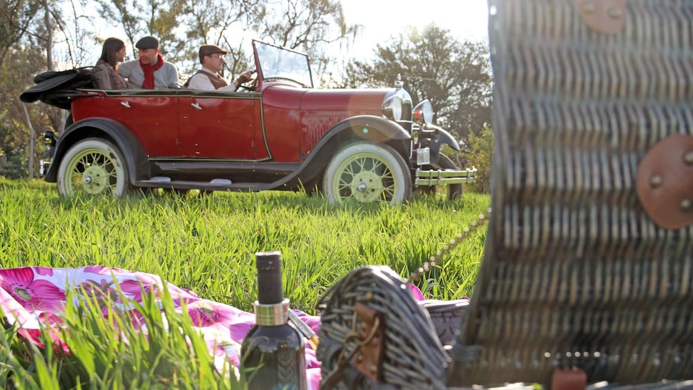 Show item 1 of 5. picnic basket near an antique car in Argentina