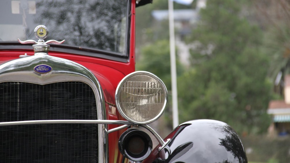 Show item 3 of 5. looking at an antique car in Argentina