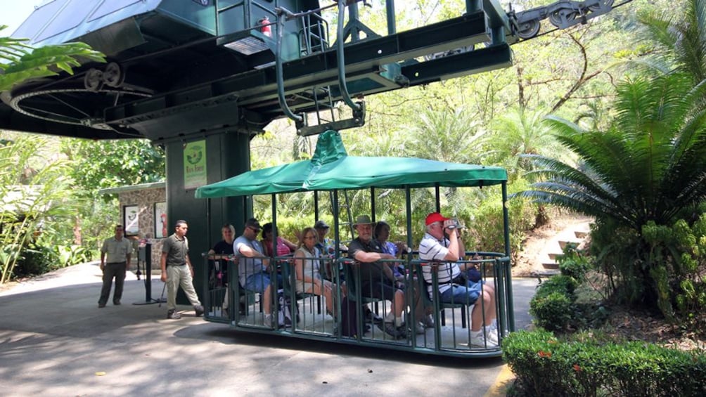 group seated on the aerial tram in Costa Rica