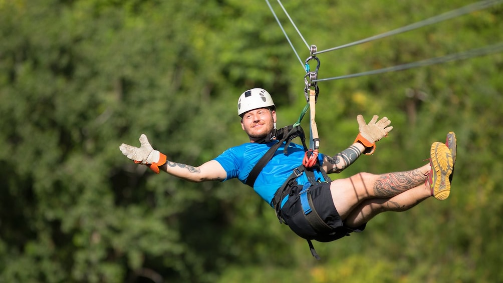 man zip lining in Costa Rica
