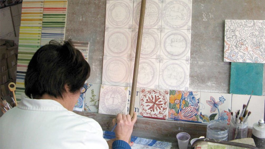 Person working on tiles in Lisbon 