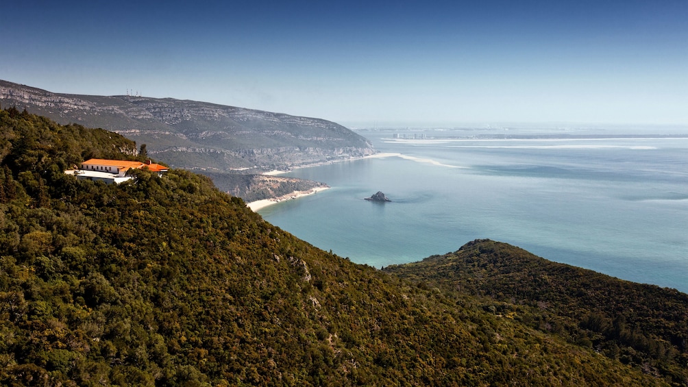 Hillside home nestled in the forest overlooking the coast in Arrabida