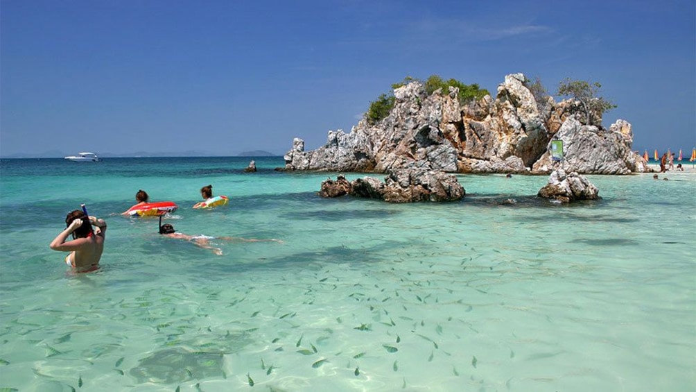 guests swimming at khai nok island phuket