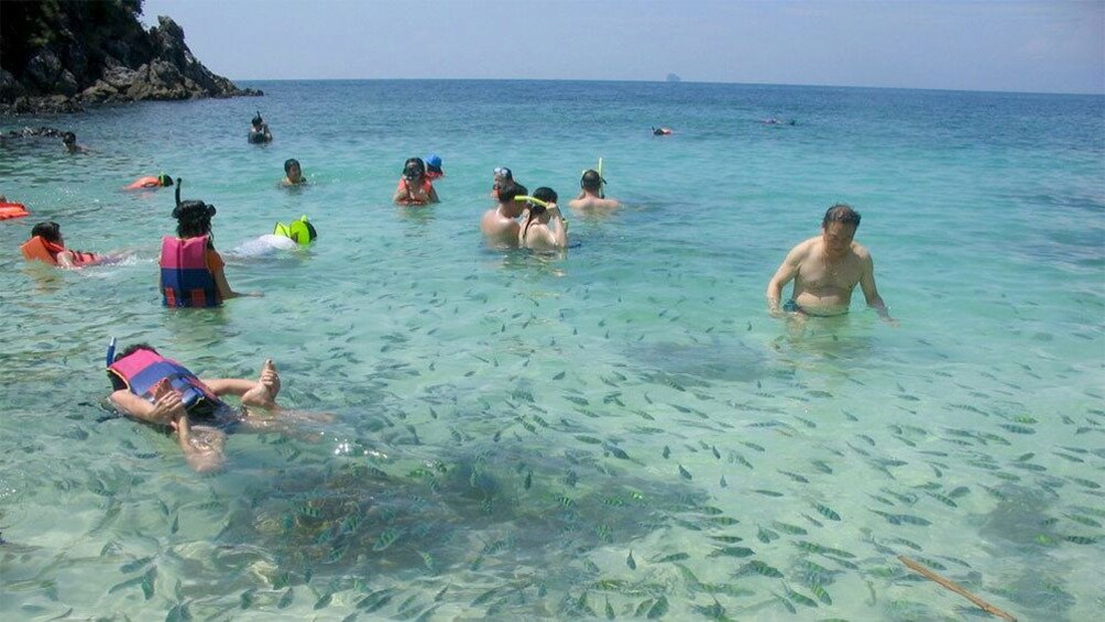 guests swimming at khai nok island phuket