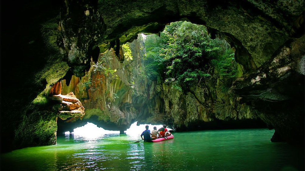 Boat tour going through a cave in Phuket 