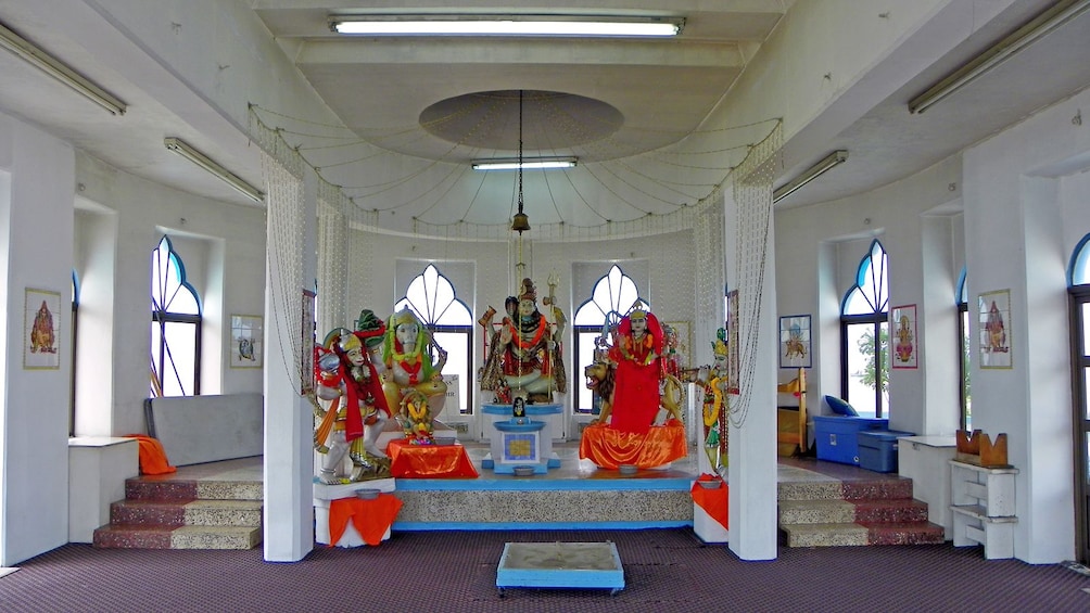 religious sculptures inside a small temple in Trinidad and Tobago