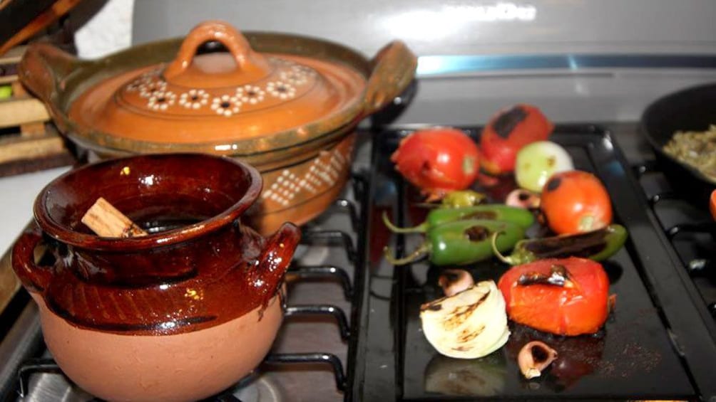 Peppers, Onions and garlic roasting on a burner