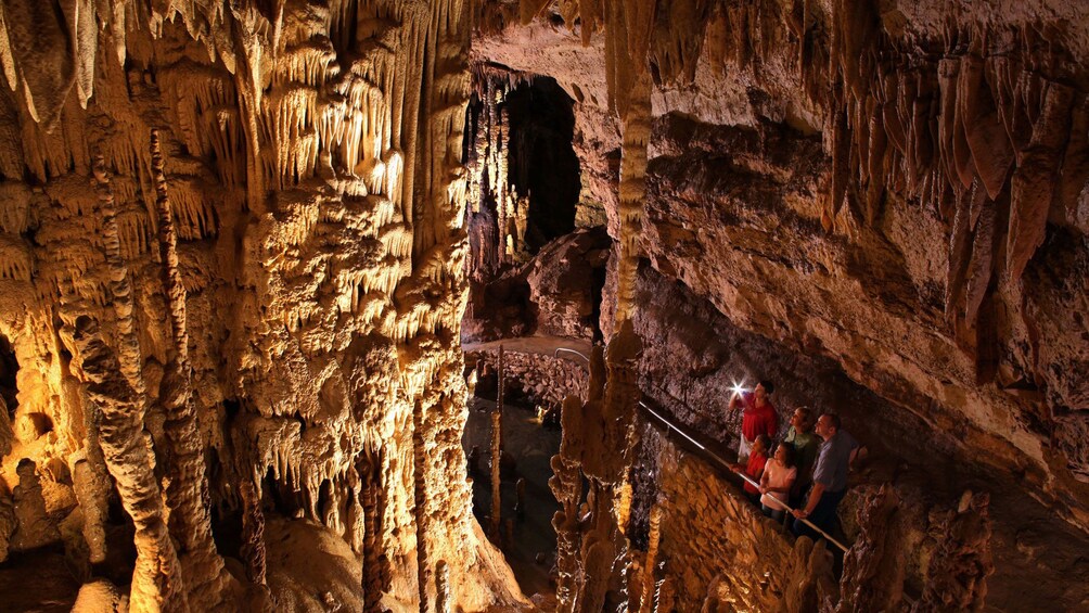People exploring a cave in San Antonio