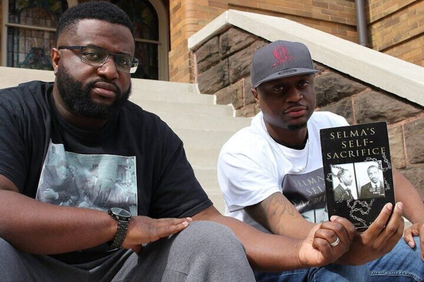 Alan and Marvin Reese holding Selma's Self Sacrifice. Autobiography of F.D.Reese