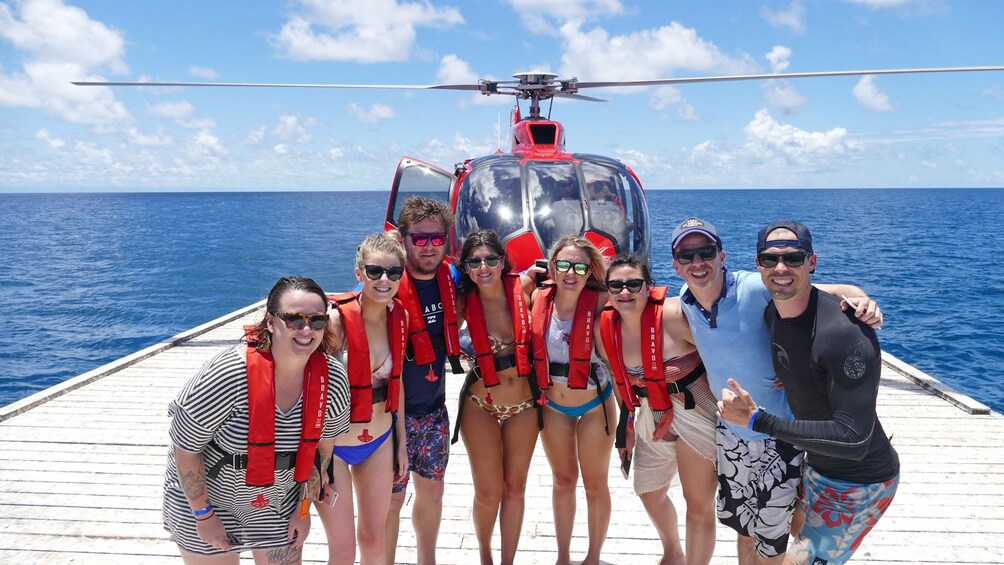 group on a helicopter water landing pad in Australia