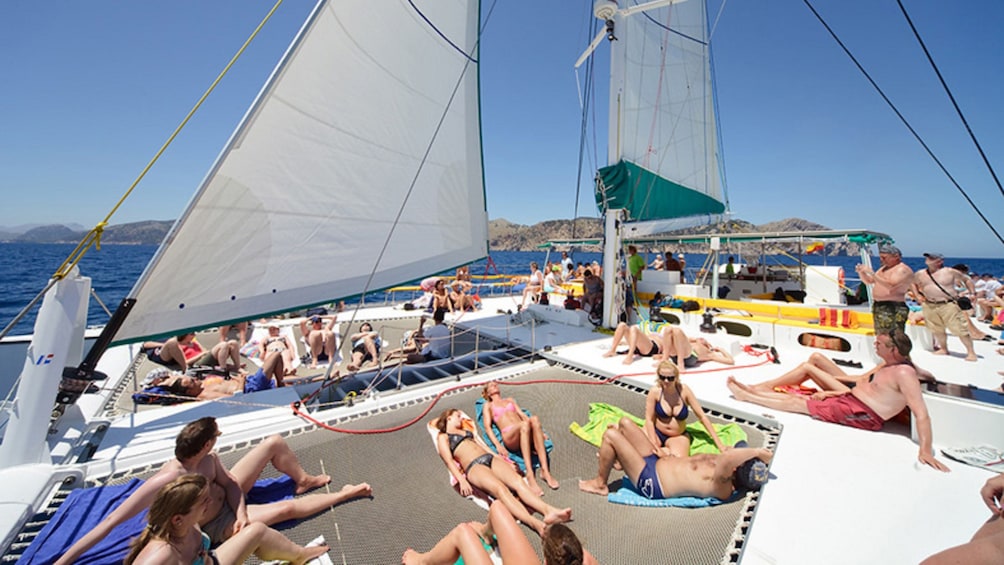 Sunbathers on a Catamaran