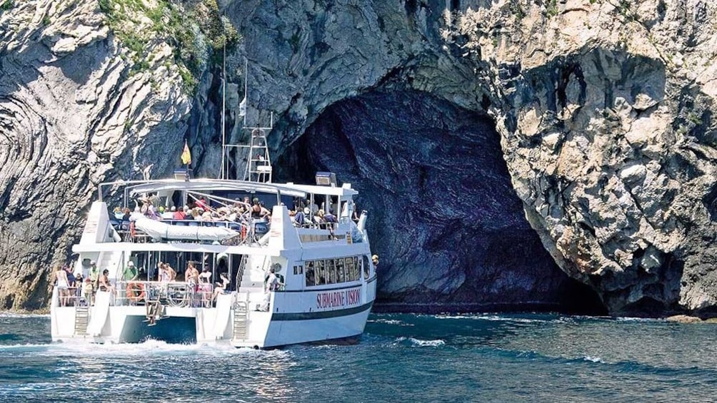 Cruise boat next to Coastline of Majorca